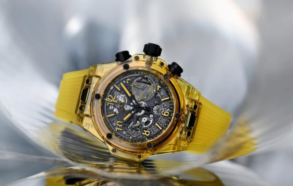The yellow sapphire case fake watch has a yellow rubber strap.